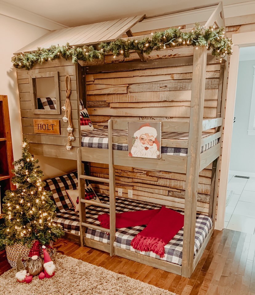 A rustic wood-look bunkbed decorated in Christmas decor.